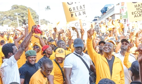  Alan Kyerematen (arrowed) responding to cheers from the crowd during the "Afranfranto Mega Victory Walk" in Kumasi