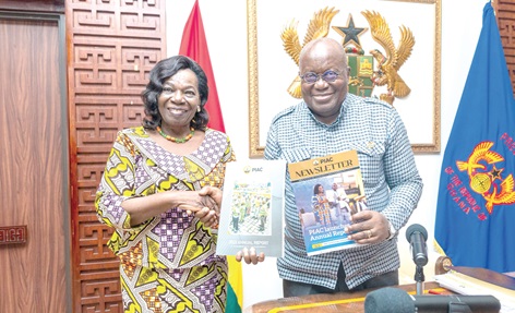 Emerita Prof. Elizabeth Ardayfio Schandorf (left), Chairperson of PIAC, presenting copies of the PIAC Annual Report and Newsletter to President Akufo-Addo
