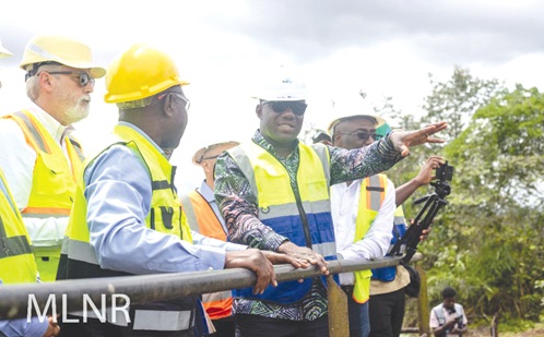  Samuel A. Jinapor (right), Minister of Lands and Natural Resources, interacting with GMC officials at the company site