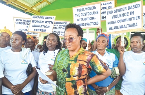 Lydia Miyella (middle), Executive Director, Maaltaba Peasant Women Farmers Cooperative, speaking during the event