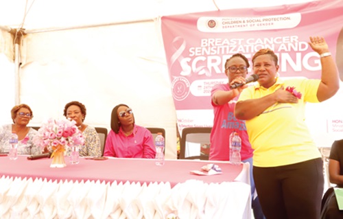 Victoria Offei (right), Senior Nursing Officer, Korle Bu Teaching Hospital, demonstrating to participants on how to examine the breast during the event. Picture: EDNA SALVO KOTEY