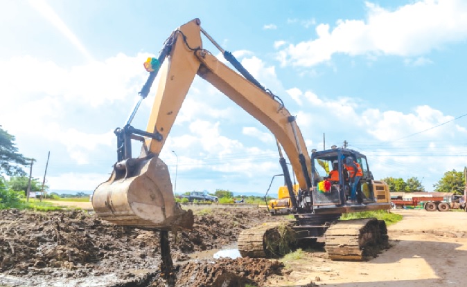 Yaw Frimpong Addo, Deputy Minister of Food and Agriculture in charge of Crops, behind the controls of an excavator to symbolically cut the sod for commencement of rehabilitation works of phase two of the Kpong Irrigation Scheme. Pictures: BENJAMIN GLOVER