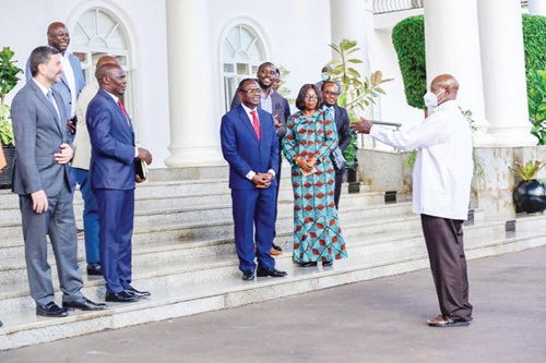 Yoweri Kaguta Museveni (right), the President of Uganda, interacting with Dr Joseph Siaw Agyepong (left), Executive Chairman of Jospong Group, and Florence Larbi (2nd from left), the Chief Operating Officer, Environment and Sanitation Cluster of Jospong Group of Companies. With them are some officials
