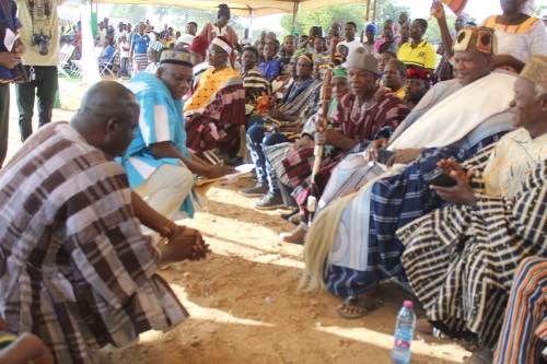  Alhaji Dr Hafiz Bin Salih (left), Upper East Regional Minister, exchanging pleasantries with Naba Bilia Maletinga III (2nd from right), Paramount Chief of the Zuarungu Traditional Area, during the event