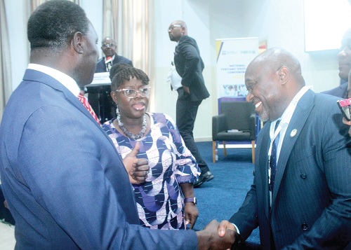  Mercy Larbi, Deputy Commissioner of CHRAJ, presenting the document to Dr Yaw Adutwum, Minister of Education