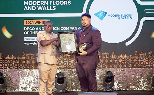 Basil David Anthony (right) receiving the award