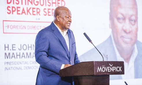 Former President John Mahama (left) addressing the participants
