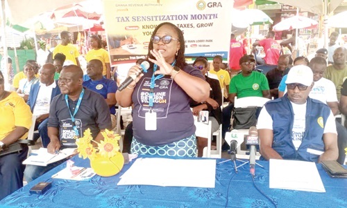  Assistant Commissioner Lydia Owusu Banahene (with mic), Tema Community One Taxpayer Service Centre Office Manager, speaking at the sensitisation programme. Picture: BENJAMIN XORNAM GLOVER