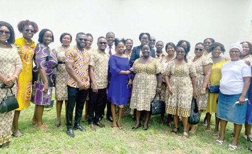 Pearl Tabua Benning (arrowed), President, GCB Ladies Association, and her team with Anniellie Danso’s family and the medical team