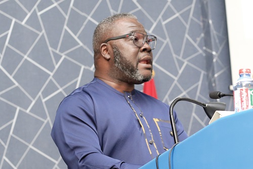 Kwame Baah Acheamfour (left), Director, International Affairs, Ministry of Communications &amp; Digitalisation, addressing participants in the conference