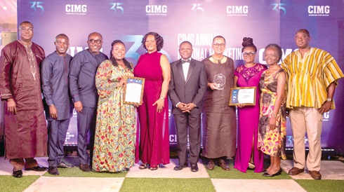  Some managers and staff of GCB Bank displaying their citations and shield