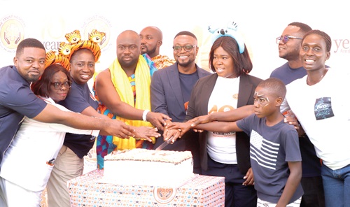 Frederick Boahene (5th from right), Dr Juliana Oye Ameh (4th from right) and other officials of the hospital and dignitaries cutting the 10th anniversary cake at the ceremony.  Picture: EDNA SALVO KOTEY