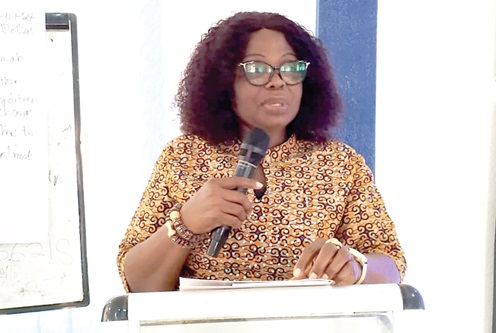 Justina Owusu-Banahene (inset), Bono Regional Minister, addressing the participants