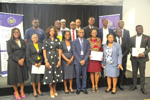 Stephen Cudjoe-Seshie (3rd from right), standing with cybersecurity service providers, establishments and professionals who received the second batch of certificates and accreditation. Picture: CALEB VANDERPUYE 