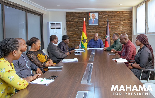Former President John Dramani Mahama (seated in-between the flags) with the delegation from the West African Elders Forum and some officials of the NDC