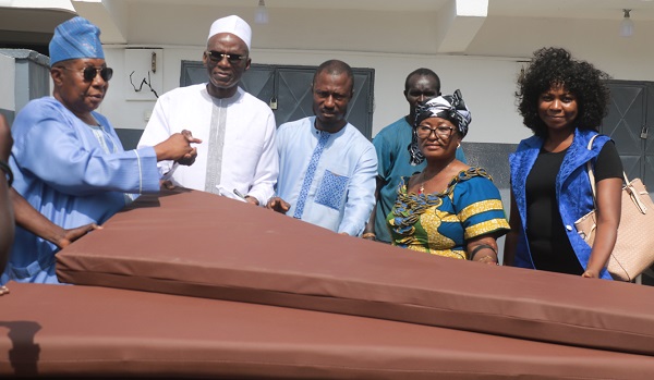 From Left: Chief Imam's Protocol Officer, Alhaji Latif Abdulsalam officially receiving some of the leather-covered students' mattress   from the Export Manager of Latex Foam, Dr. Yakubu Diomande (2nd left). Looking on are Salis Nuhu; Mercy Nyanteh; a Latex Foam distributor, and Ms. Gifty E. Appiah, Public Relations Officer of Latex Foam. 