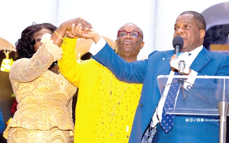 Reverend Stephen Wengam (left), General Superintendent, Assemblies of God, declaring  Apostle Dr Ernest Narh Adulai’s retirement from active service. Joining hands with them is Mabel Adulai, wife of the retiring minister.