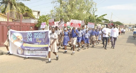 Schoolchildren parading through the streets of La to create awareness of rabies