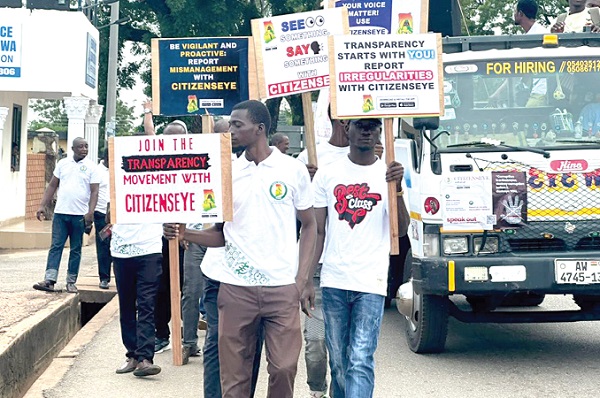 Staff of the Audit Service wielded placards during the road show