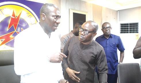  Alexander Afenyo-Markin (left), Chairman of the Board of Directors of the Electricity Company of Ghana, interacting with David Asamoah, acting Managing Director of ECG, after the meeting. Pciture: ESTHER ADJORKOR ADJEI 