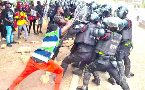 Some protesters in a scuffle with the riot control police