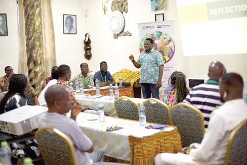 Charles Yao Mawusi interacting with the media practitioners during the workshop