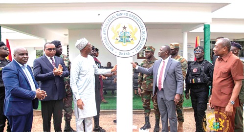 Armah-Kofi Buah (right), Minister of Lands and Natural Resources, and Muntaka Mohammed Mubarak (left), Minister for the Interior, jointly inaugurating the office. With them include Ernest Brogya Genfi (2nd from left), Deputy Minister of Defence, and Martin Ayisi, Chief Executive Officer, Minerals Commission