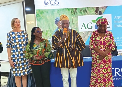 Ali Adolf John (2nd from right), Northern Regional Minister, being supported by Vivian Hilde Opsvik (left), Deputy Head of Cooperation, Royal Norwegian Embassy; Abena Amedomey (2nd from left), Country Representative of CRS, and Hawa Musah (right), Northern Regional Director of Agriculture, to launch the project 