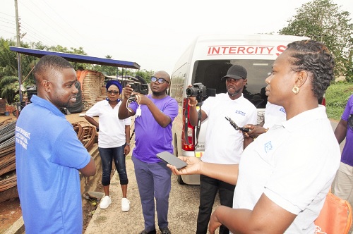 Divine Kwami Adzime, Plan International Ghana borehole spare parts project coordinator, briefing some of the journalists