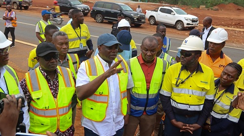 Kwame Agbodza (arrowed), Minister of Roads and Highways, with engineers and officials from Newmont after an inspection of the Terchire bypass, Bono Region