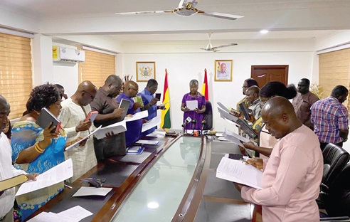 Emelia Arthur (middle), Minister of Fisheries and Aquaculture, swearing in the 11-member board for the National Premix Fuel Committee