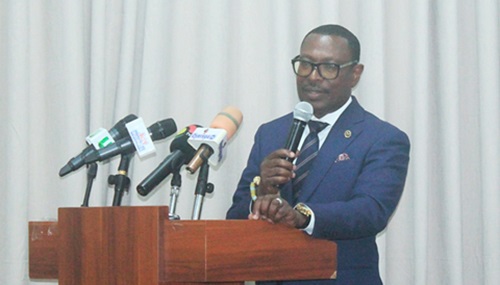 A section of participants seated in the lecture. INSET: Dr Ishmael Nii Amanor Dodoo, Head of Innovative Finance, Partnerships and Market, 24-hour Economy and Accelerated Export Secretariat, delivering a speech on behalf of Goosie Tanoh, Presidential Advisor on the 24-hour Economy and Accelerated Exports. Picture: ERNEST KODZI 