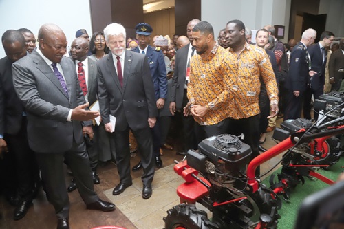 President John Dramani Mahama (left) and Petr Pavel (2nd from left), President of Czech Republic, interacting with staff of Knights a.s Ghana Limited at their exhibition stand at the Czech-Ghana Business Cooperation Seminar in Accra. Picture: SAMUEL TEI ADANO