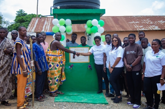 Deborah Kwablah (right), Corporate Communications and Public Affairs Manager at Nestlé Ghana Ltd. presenting the project to Baffour Nadu Tetteh I, Chief of Adumasa Manya 