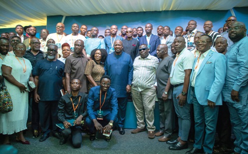 President Mahama (middle) with some participants after the forum