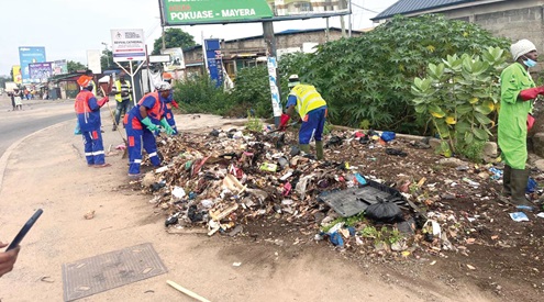  Some staff members of the Ablekuma North Assembly and residents of the municipality clearing refuse during the clean-up exercise