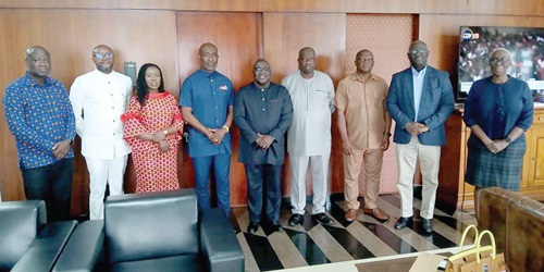 Julius Debrah (middle), Stephane Miezan (left),  Marietta Brew (right) and members of the Chamber