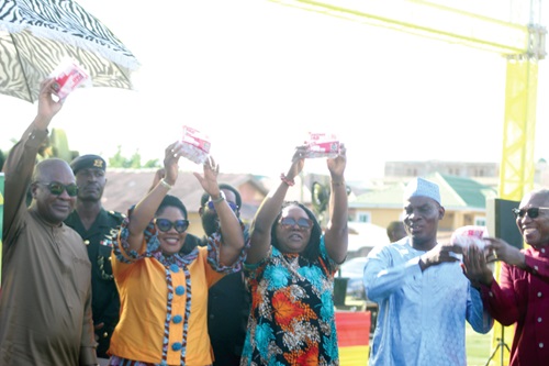 President John Dramani Mahama (left) being assisted by Dr Agnes Naa Momo Lartey (2nd from left), Minister for Gender, Children and Social Protection; Rita Naa Odoley Sowah (middle), MP for La Dade-Kotopon; Haruna Iddrisu (2nd from right), Minister of Education, and Dr Clement Abas Apaak (right), Deputy Minister of Education, to launch the programme in Accra.  Picture: ESTHER ADJORKOR ADJEI 