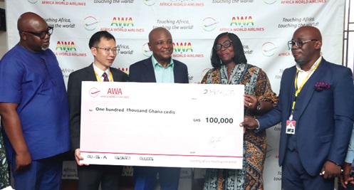 Togbe Afede XIV (middle), Founder, AWA, presenting a dummy cheque to Rejoice Acorlor (right), Headmistress, Labone SHS. With them are Andy Zhang (2nd from left), Vice President, AWA, and some dignitaries. Picture: ELVIS NII NOI DOWUONA 
