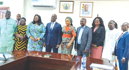 Haruna Iddrisu (4th from left), Education Minister, with members of the Board of Trustees of the Students Loan Trust