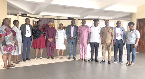 DO3 Nathaniel Amoah (3rd from right), Assistant Director, Legal, GNFS, with Kwabena Yeboah (6th from right), Marketing Consultant; Eric Opata (4th from right), Superintendent, Kaneshie MTTD, and Rev. Cyril Crabbe Bennedict (5th from right), Founder of AVSF, and other dignitaries after the event