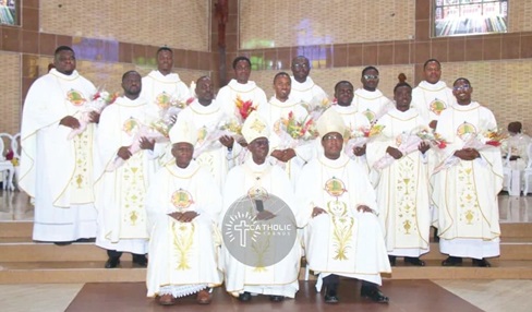 Archbishop John Bonaventure Kwofie (middle),  Metropolitan Archbishop of Accra, with the newly ordained Catholic priests. With him are Most Rev. John Kobina Louis (right), Auxiliary Bishop of Accra, and Most Rev. Anthony Narh Asare (left), Auxiliary Bishop of Accra