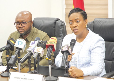 COP Lydia Yaako Donkor, Director-General of the Criminal Investigations Department of Police, addressing the media during the briefing as Divine Selase Agbeti (left), Director-General of the Cyber Security Authority, looks on during the briefing. Picture: CALEB VANDERPUYE
