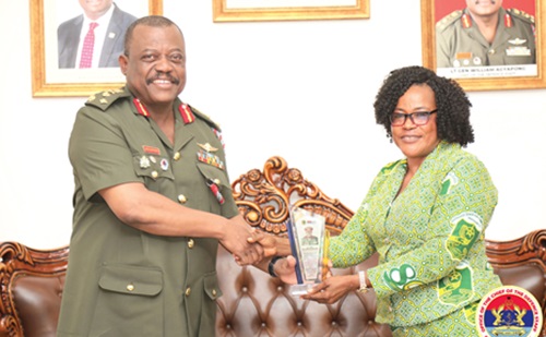 Madam Olivia Owusu, Headmistress of the school, presenting a shield of honour to Lieutenant General William Agyapong, Chief of the Defence Staff Madam Olivia Owusu, Headmistress of the school, presenting a shield of honour to Lieutenant General William Agyapong, Chief of the Defence Staff