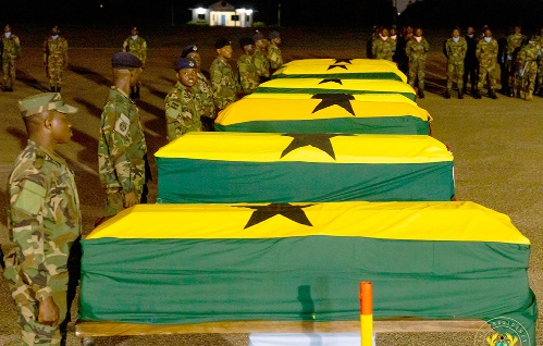 The coffins of the crash victims draped in the national flag