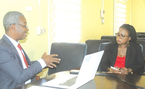 Augustine Eshollar Sagoe, an Infectious Disease Specialist and Human Identification Consultant, explains how to use DNA to identify individuals in disaster situations to Augustina Tawiah, Staff Writer of the Daily Graphic. Picture: ESTHER ADJORKOR ADJEI