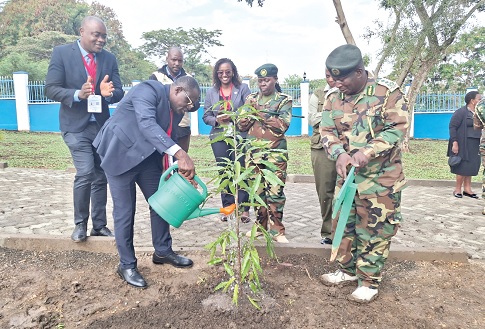 Joseph Siaw Agyepong,  Executive Chairman of the Jospong Group of Companies, watering a commemorative tree at Homa Bay Park as part of DevCon 2025 in Kenya