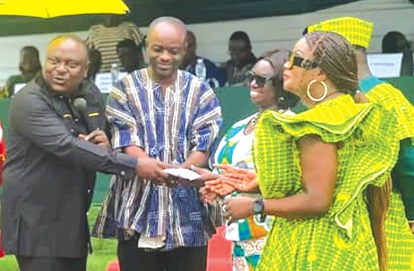 Anastasia Afua Konadu (arrowed), Headmistress of Ebenezer SHS, receiving a parcel from Rev. Dr Kweku Addo Anastasia Afua Konadu (arrowed), Headmistress of Ebenezer SHS, receiving a parcel from Rev. Dr Kweku Addo