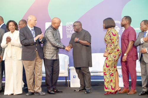 Julius Debrah (middle), Chief of Staff, interacting with Jeffrey Radebe (3rd from left), Special Envoy of President Cyril Ramaphosa, South Africa, after the ceremony of African Political Parties Summit in Accra. Picture: ELVIS NII NOI DOWUONA 