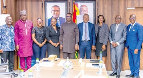 John Abdulai Jinapor (middle), Minister of Energy and Green Transition, with the board members of the Energy Commission after their inauguration.